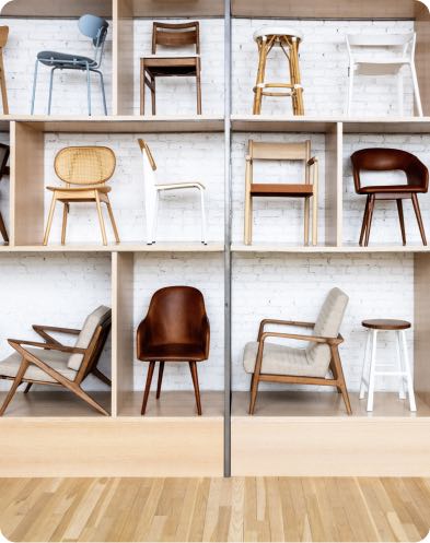 A naturally lit showroom display of Industry West's popular chairs ad stools